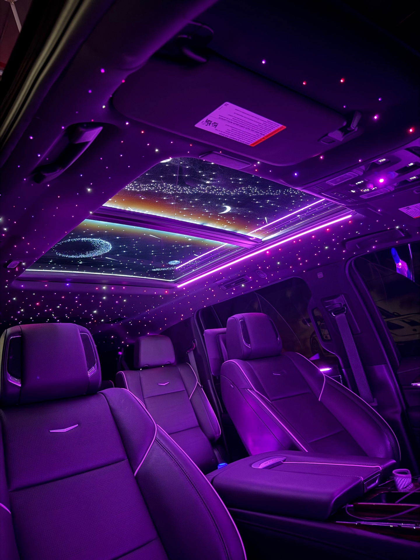 Cadillac Escalade starlight headliner with purple ambient lighting
